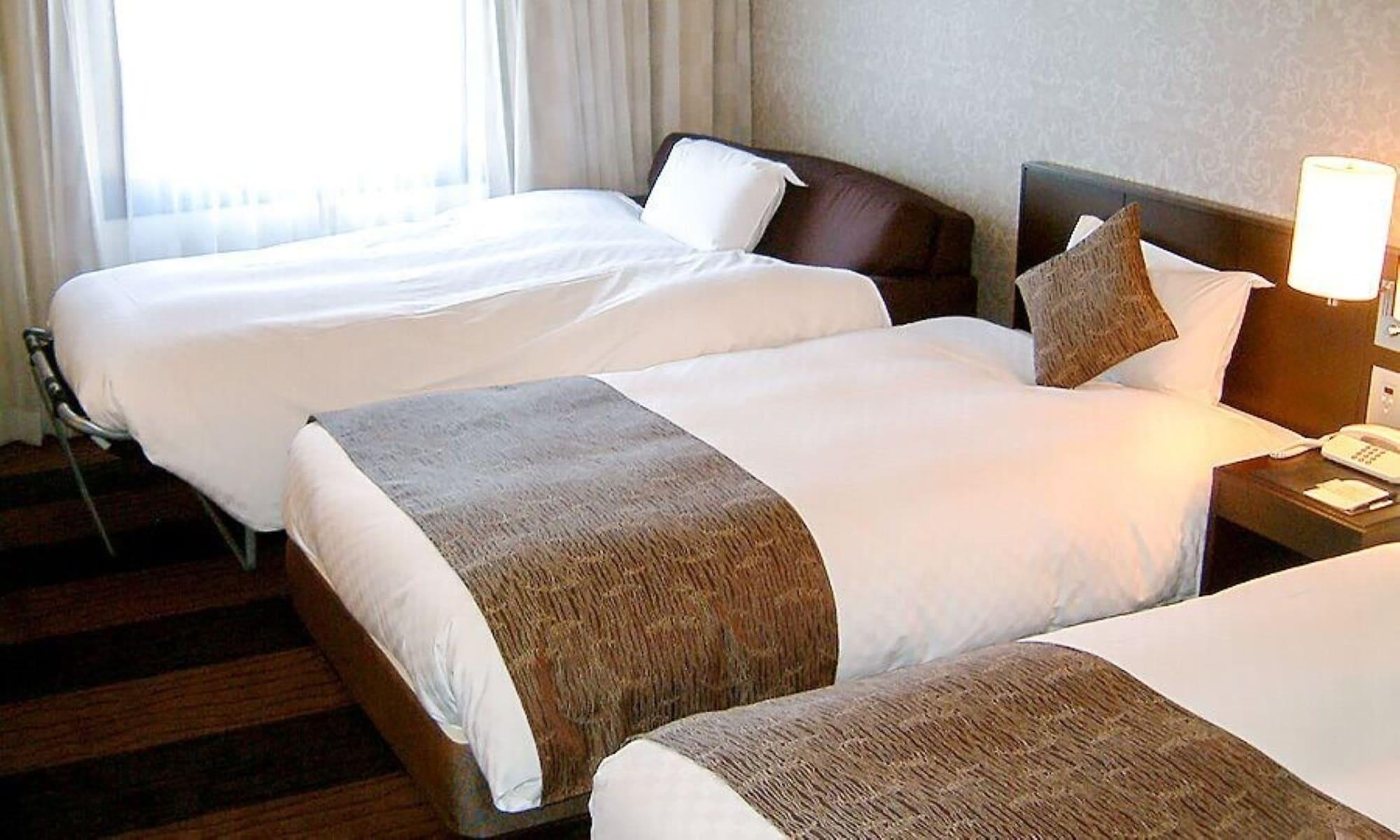 Hotel Granvia Wakayama Exterior foto Beds with bed runners
